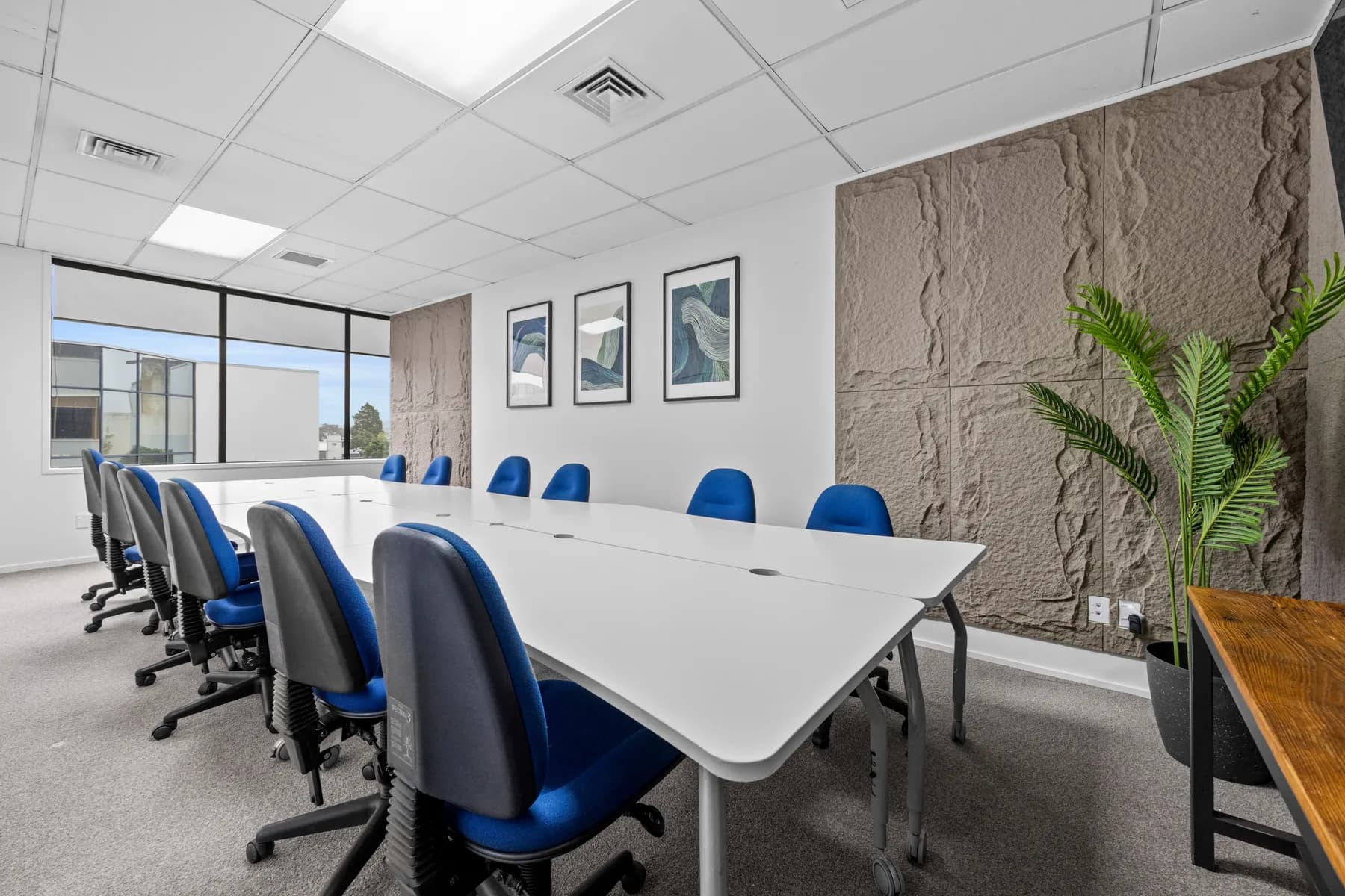 Studio.101 boardroom with a 12-seat table and presentation display